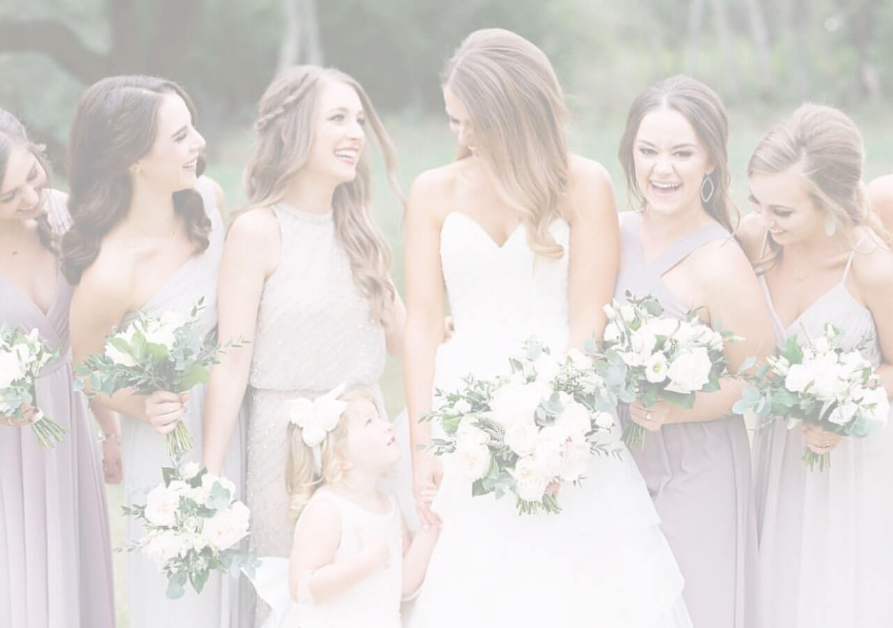 Photo of bridesmaids wearing purple dresses